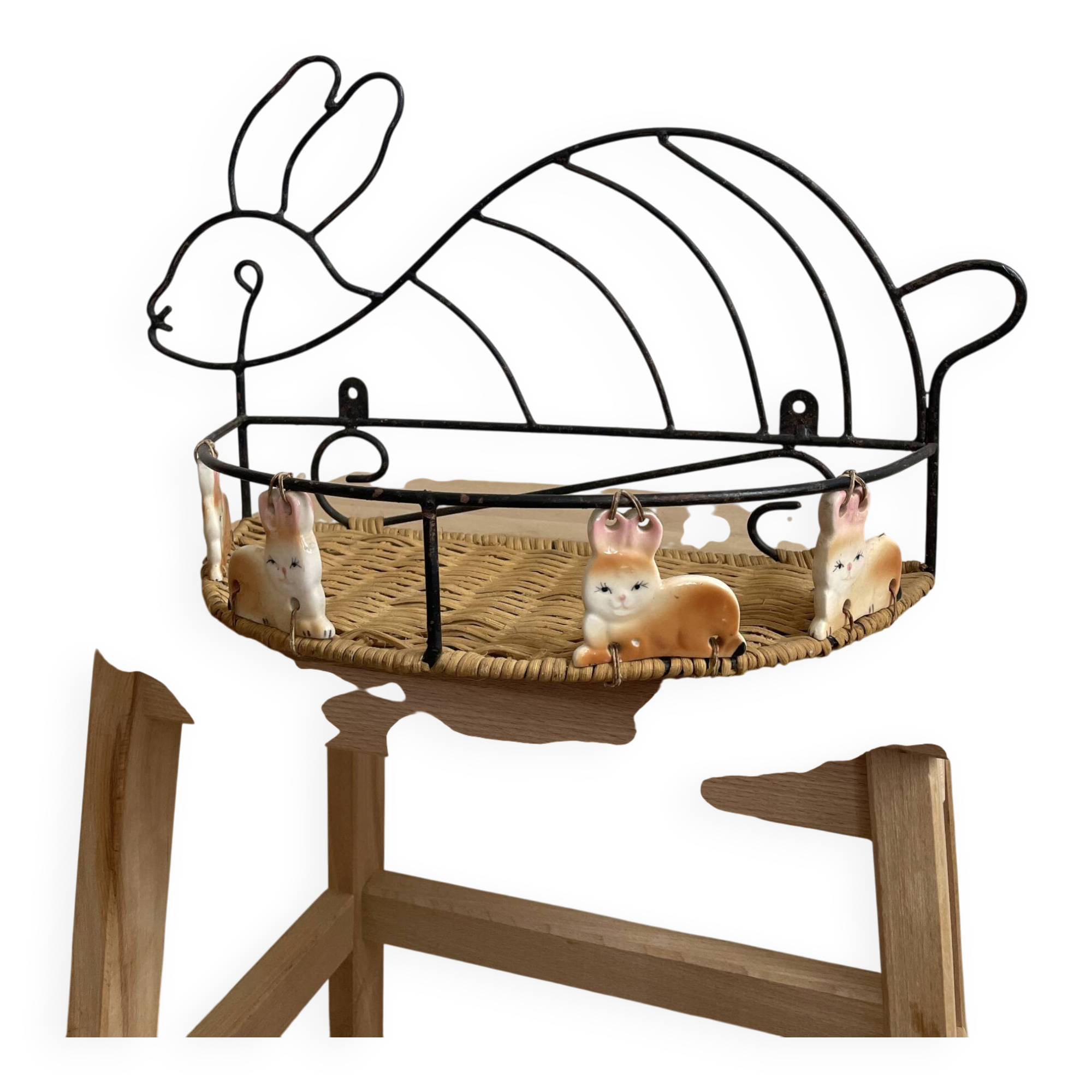 Wrought iron shelf and porcelain rabbit figurines