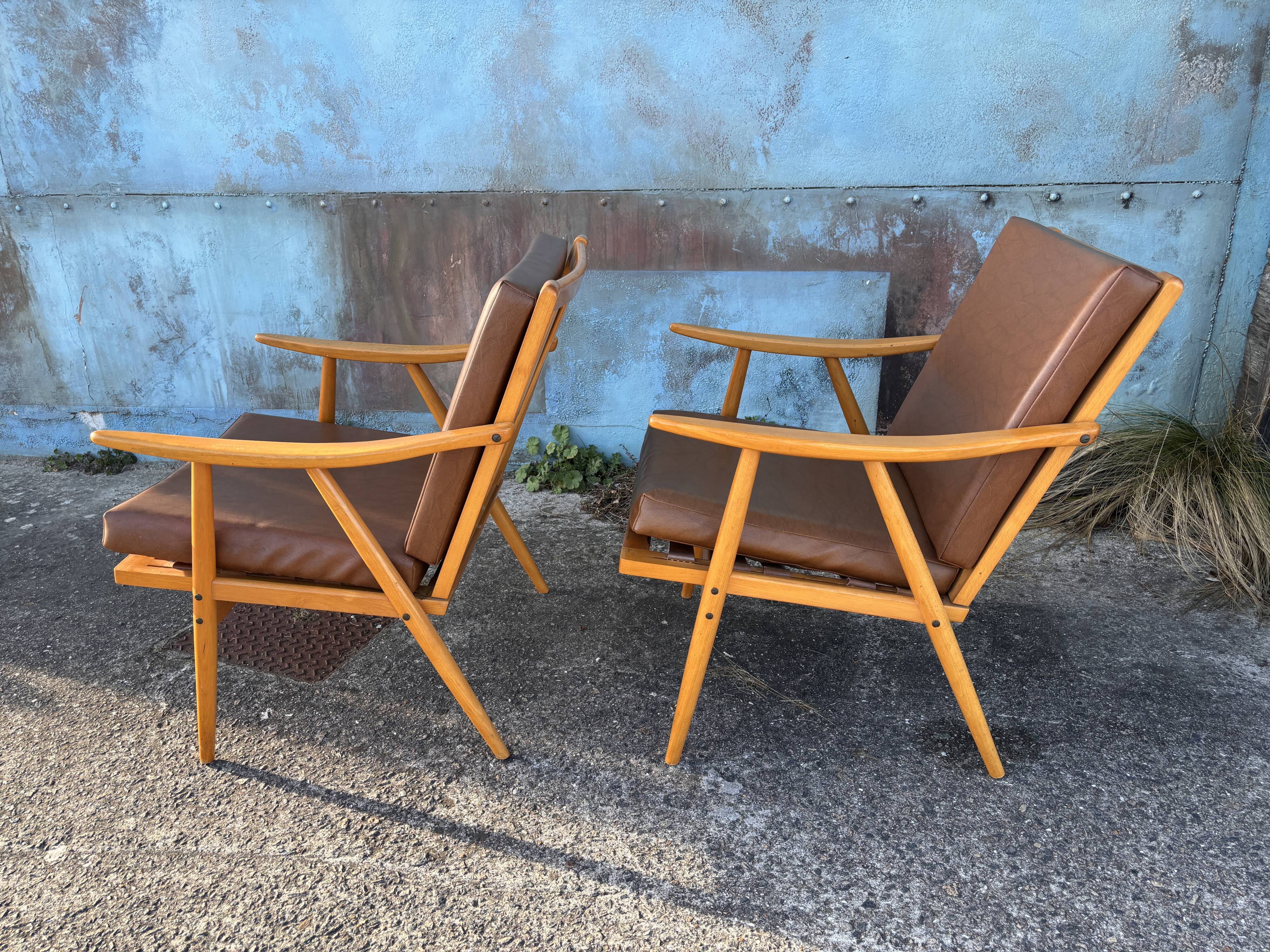 Pair of vintage armchairs with compass legs, "Boomerang" model by THO editions.