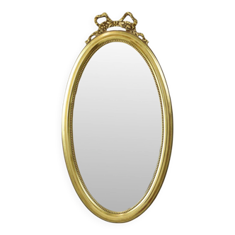 Miroir ovale classique doré à décor de ruban, France
