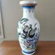 Vintage ceramic vase with Asian decor.