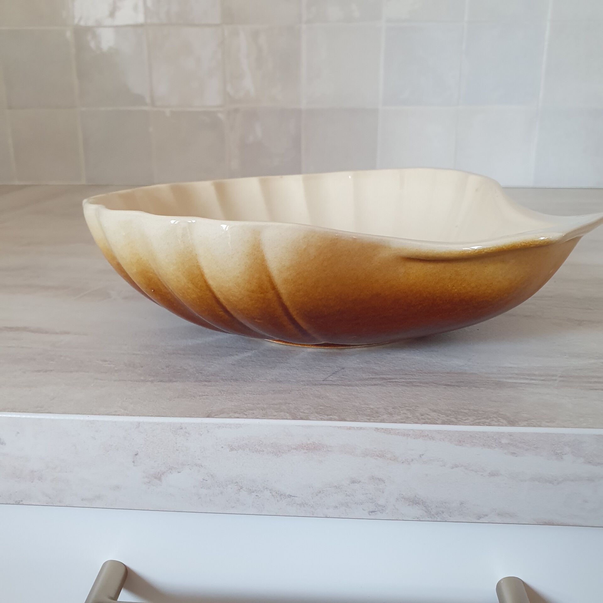 Brown and white ceramic shell bowl