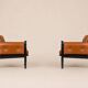 Paire de fauteuils lounge « safari » en cuir cognac et hêtre noir — c. 1970