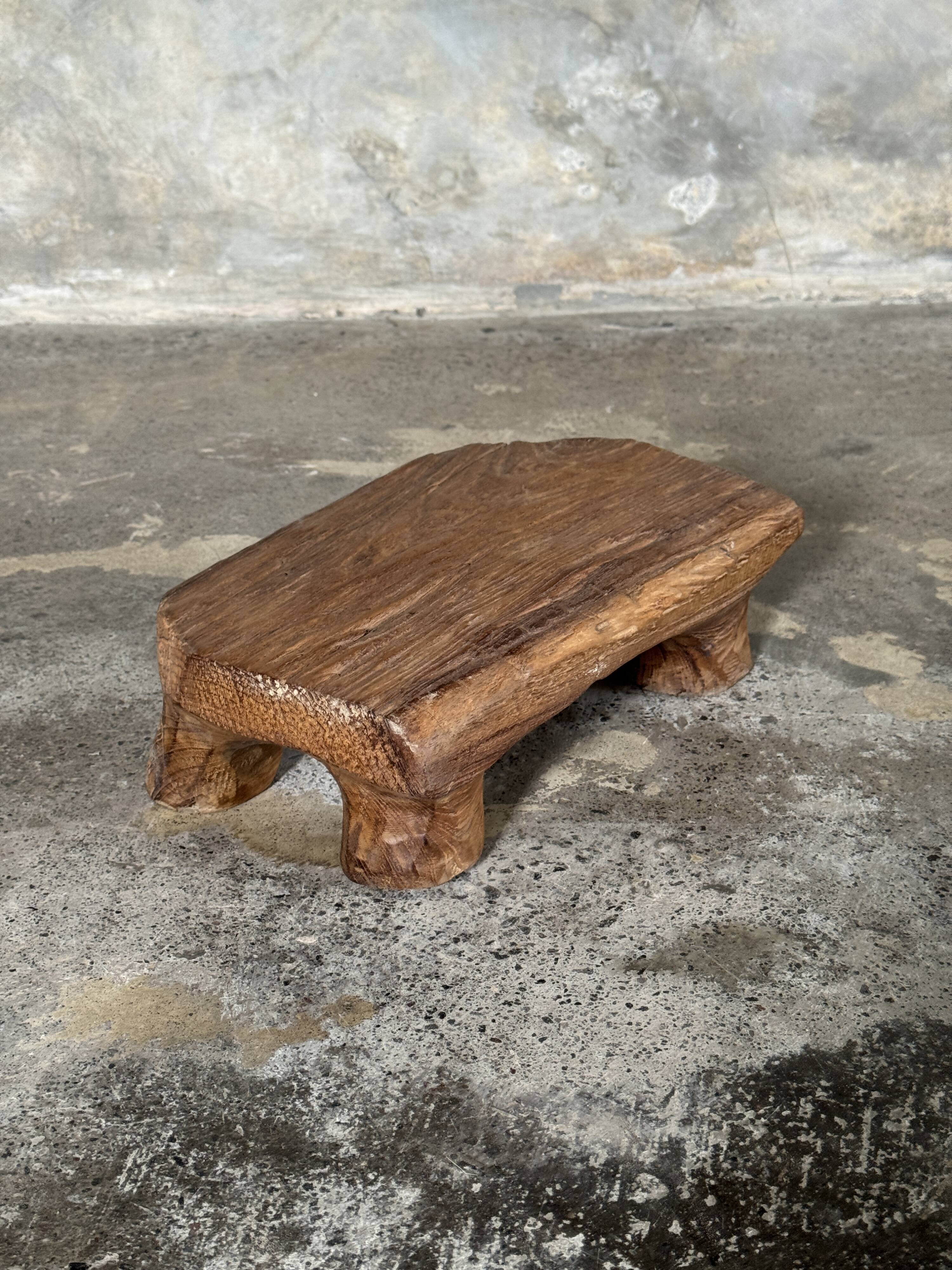 Small stool, teak footrest with short cut corners.