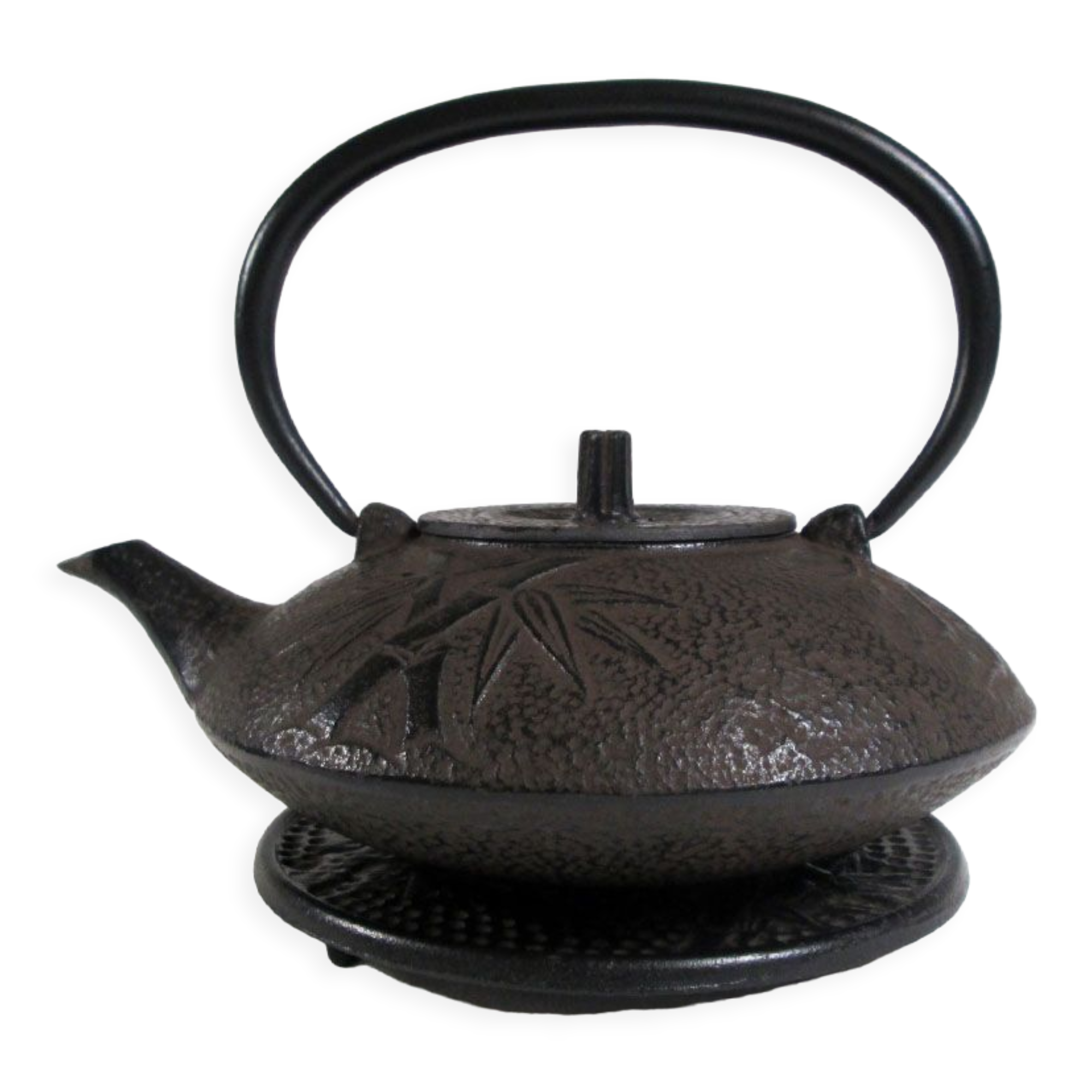 Antique cast iron teapot decorated