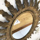 Miroir doré soleil fleuri ancien