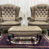 Pair of high-backed Chesterfield armchairs with 1 leather footrest