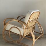 Large rattan rest chair and white cushions