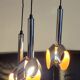 Massive Belgique three-armed waterfall pendant lamp in chrome and orange lacquer