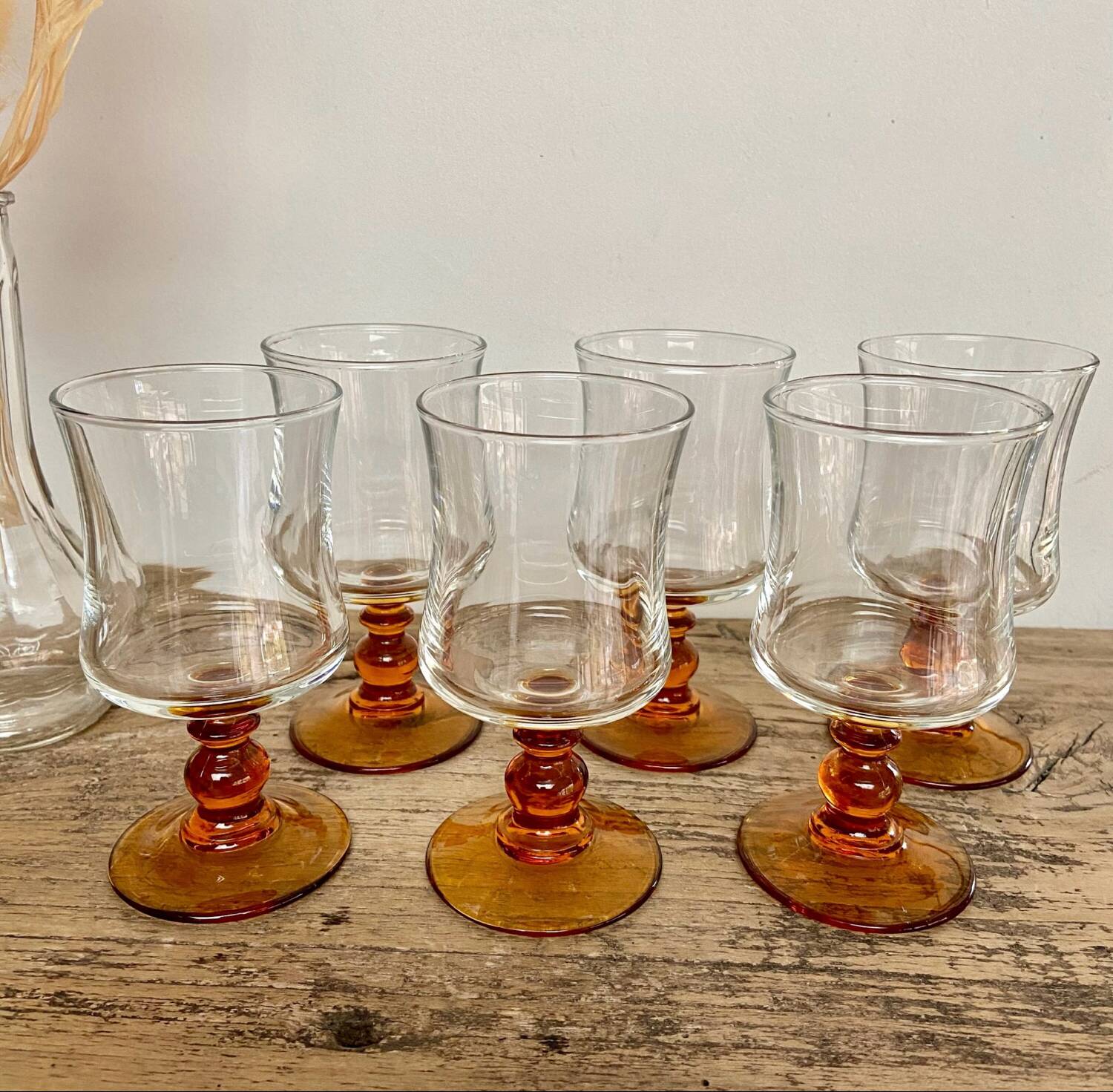 6 small amber stemmed glasses