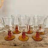 6 small amber stemmed glasses