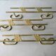Set of 3 coat hangers in gold metal, 60s