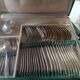 Silver metal cutlery. 12 spoons+12 forks+12 teaspoons+ladle. In box.