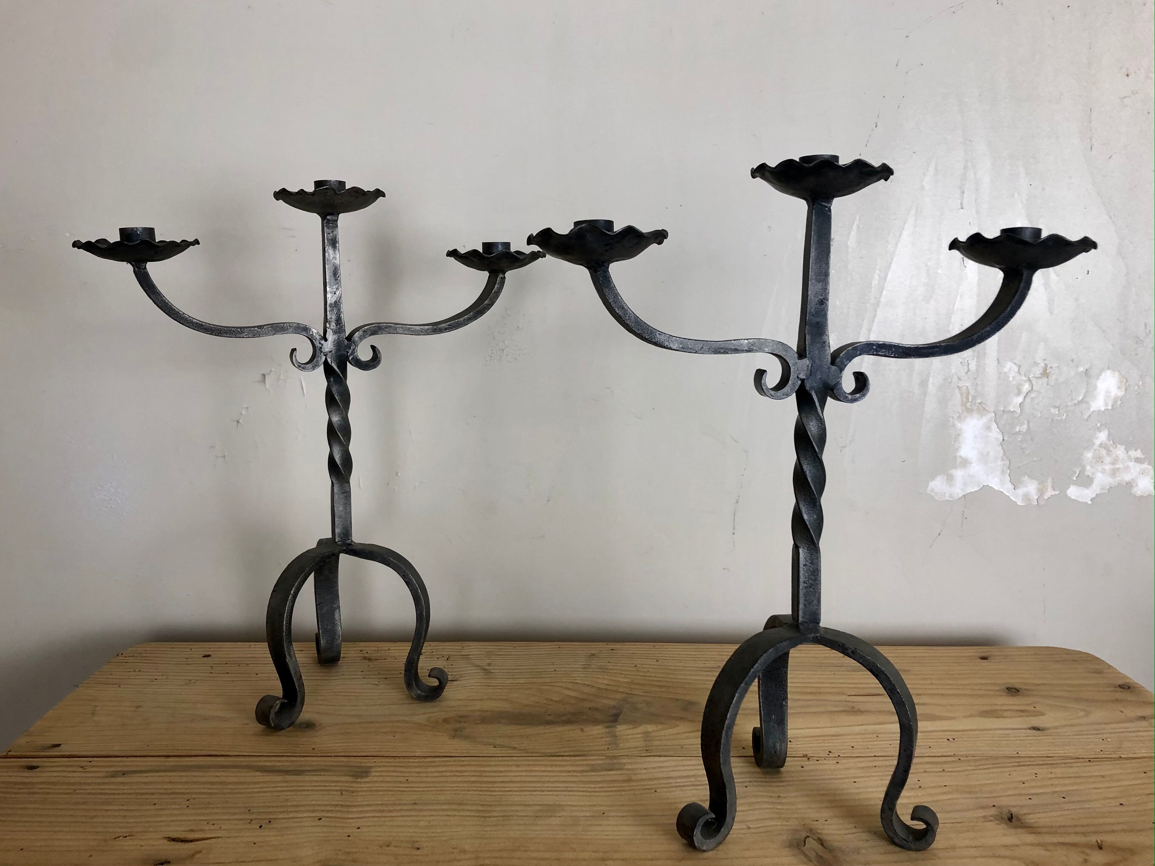 Pair of wrought iron candlesticks