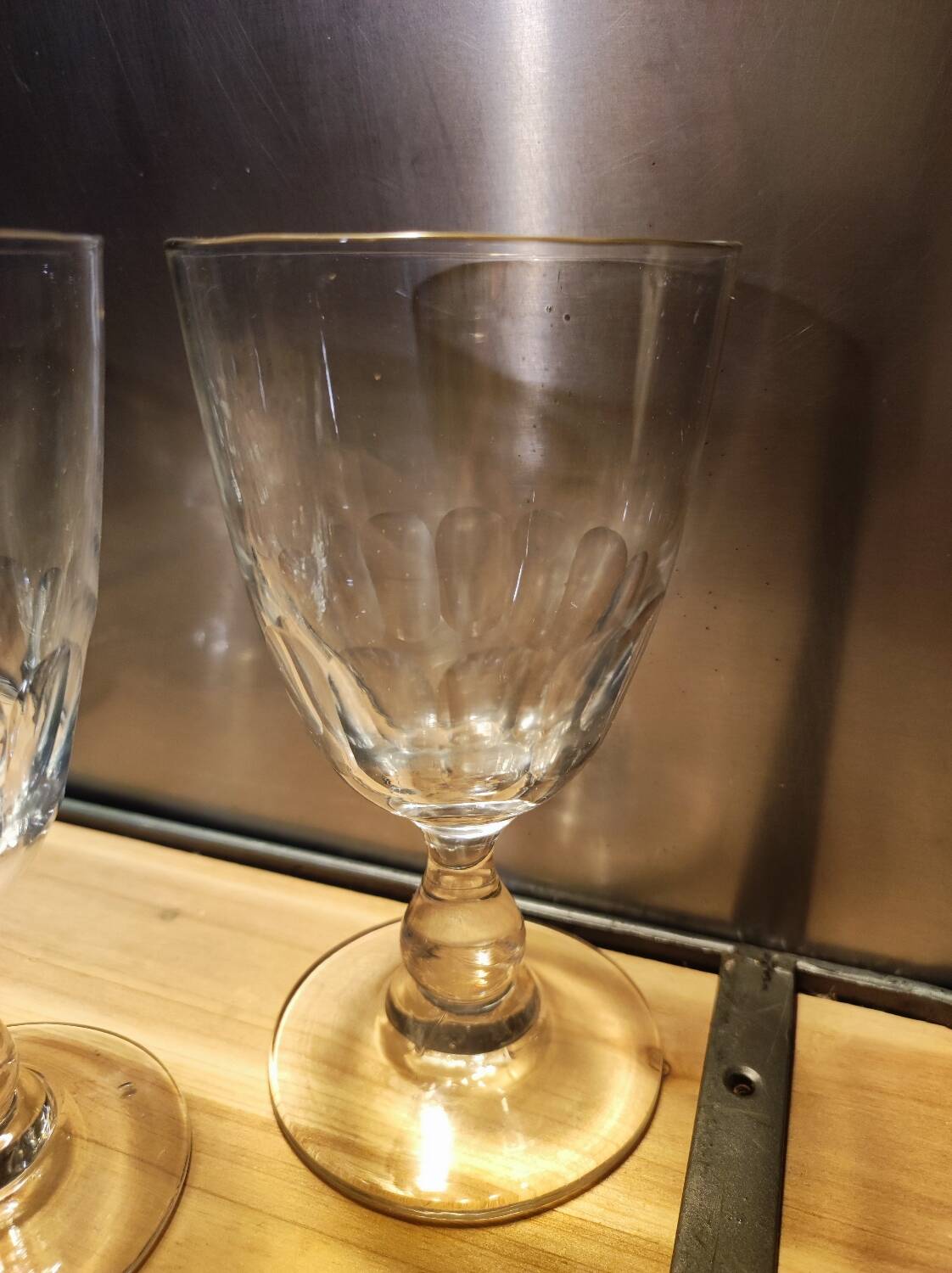 5 antique wine glasses with cut sides