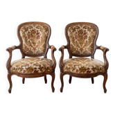 Pair of Louis XV armchairs in wood and floral fabric.