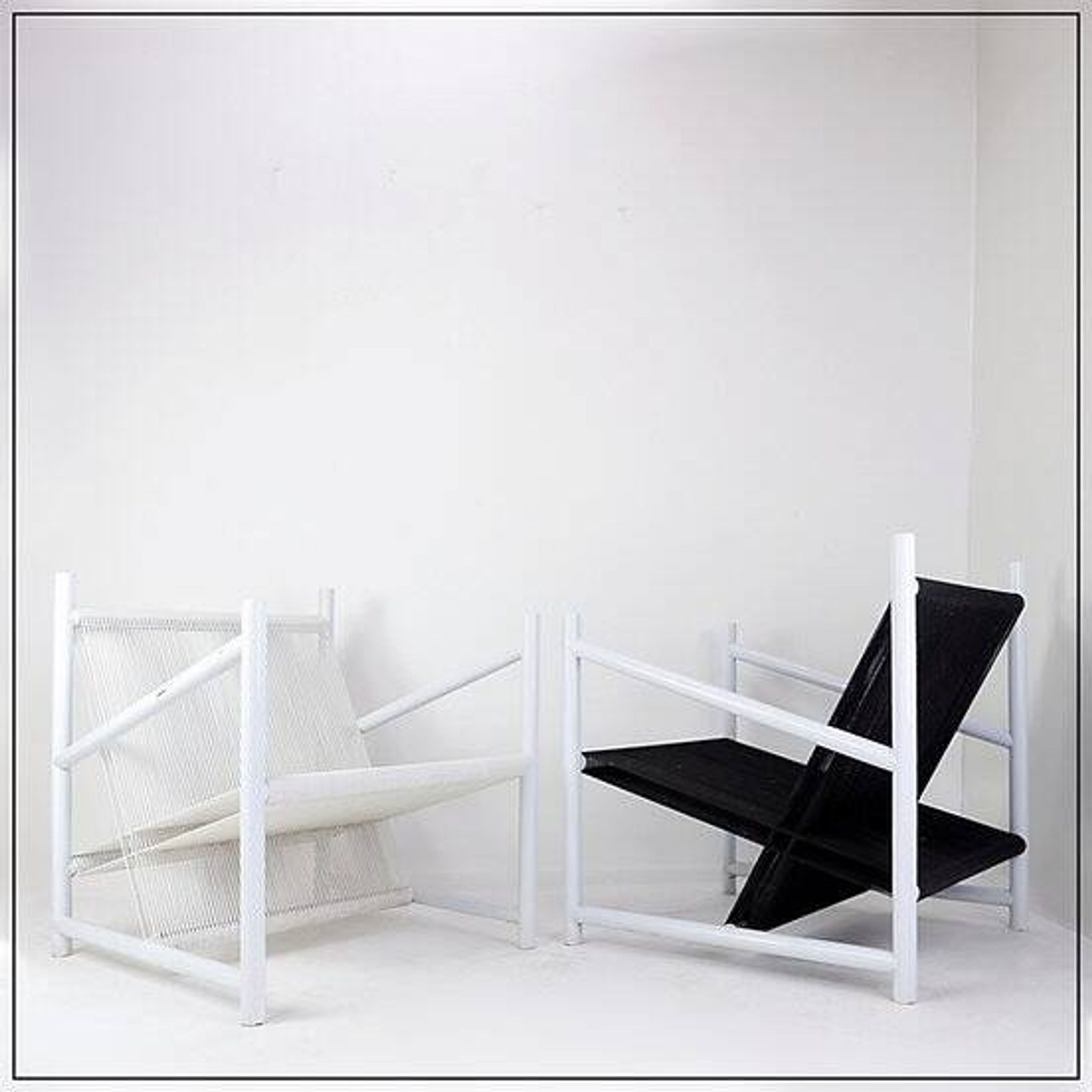 Indoor/Outdoor pair of Black/White Armchairs