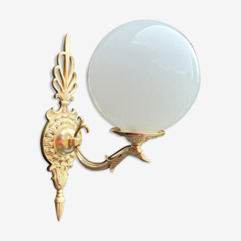Brass "bird" wall lamp and opal globe