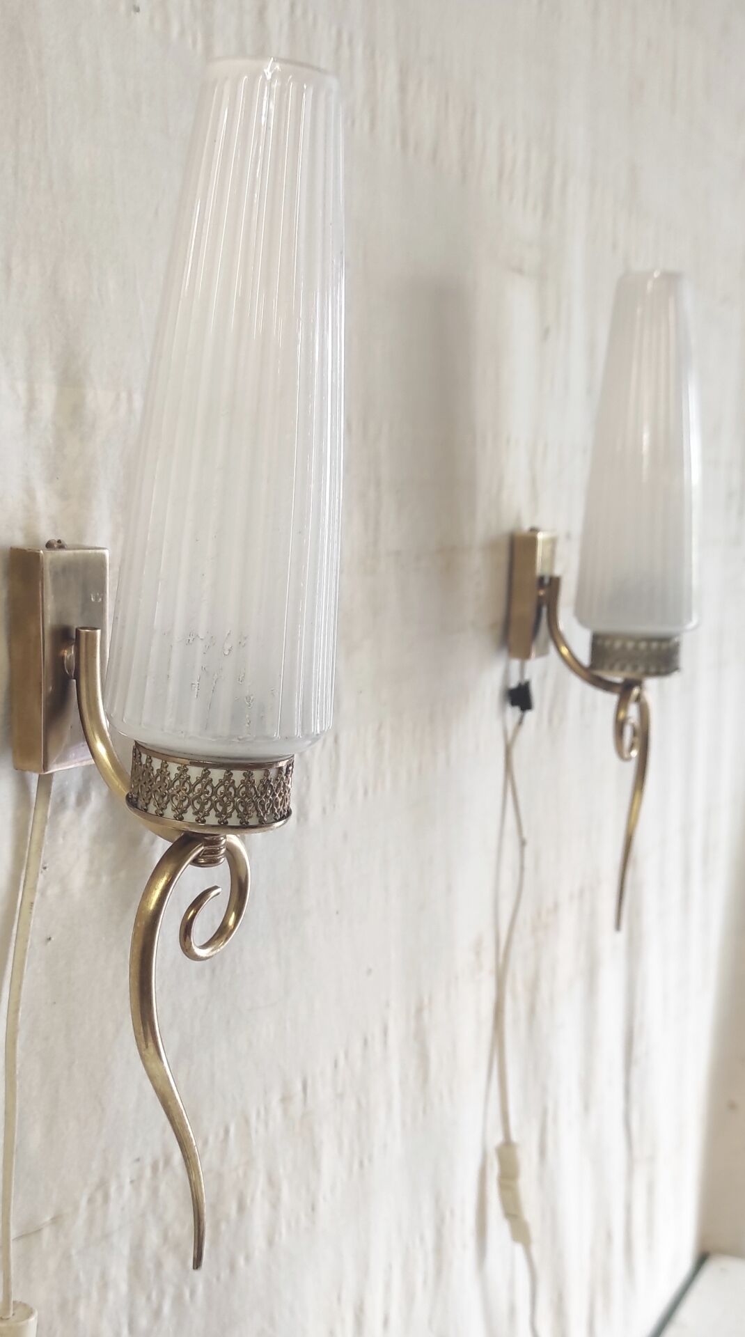Modernist wall lights in brass and opaline - mid 20th century.