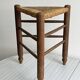 Triangular turned wooden stool