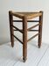 Triangular turned wooden stool