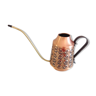 Scandinavian-style red copper watering can