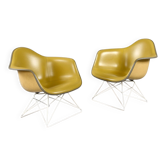 Pair of Eames for Herman Miller LAR shell chairs with yellow Naugahyde pads