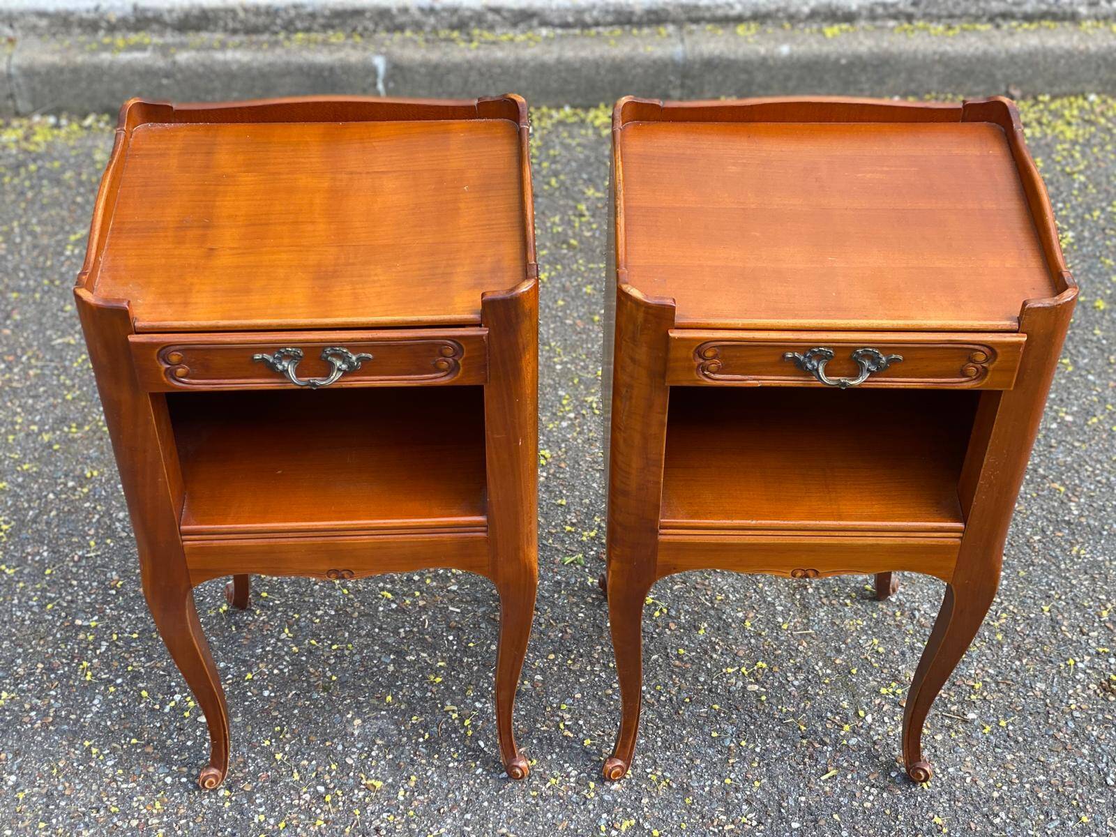 2 Louis XV bedside tables made of curved solid wood with drawers.
