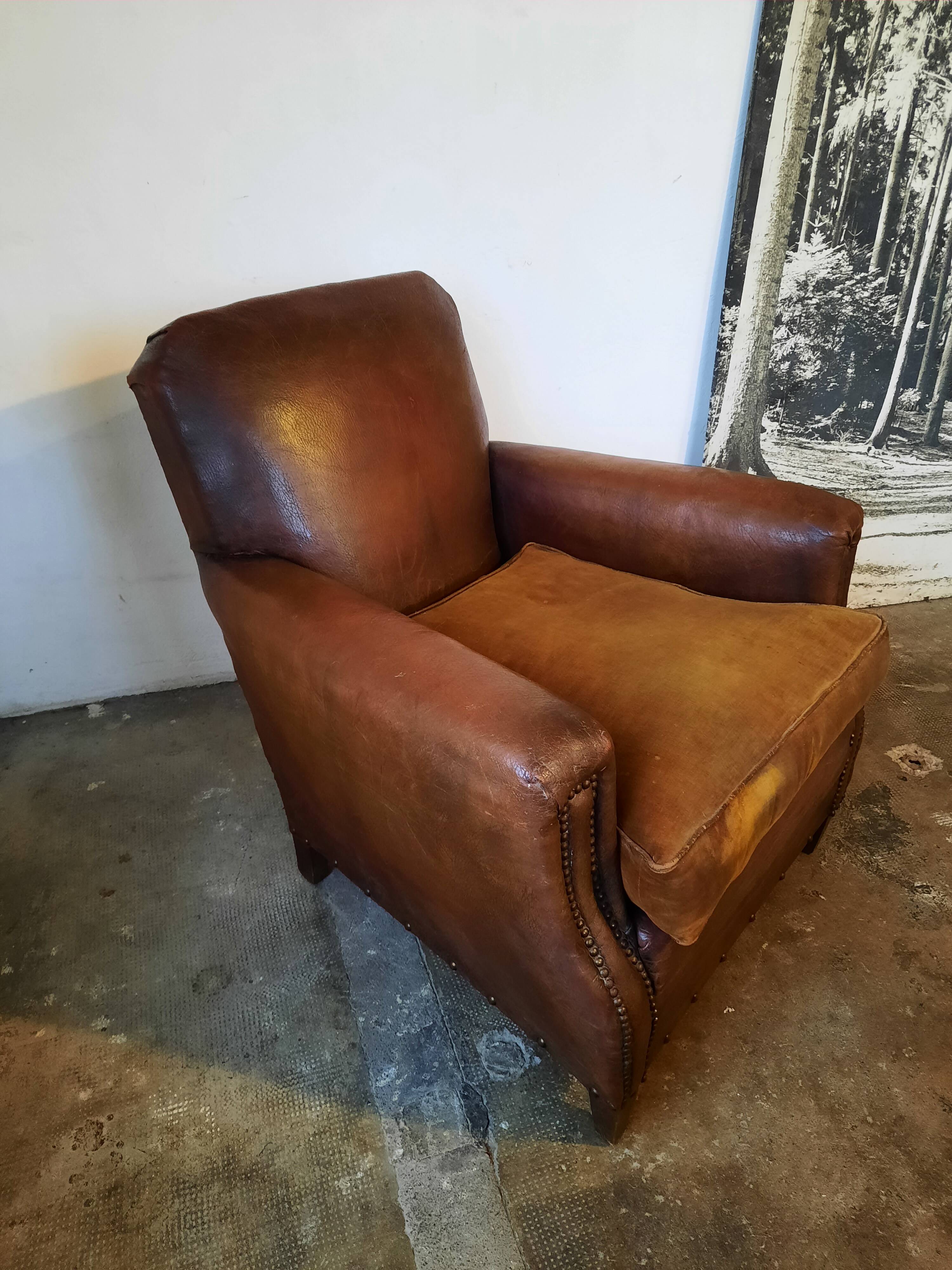 Old studded leather club chair 1930-1930