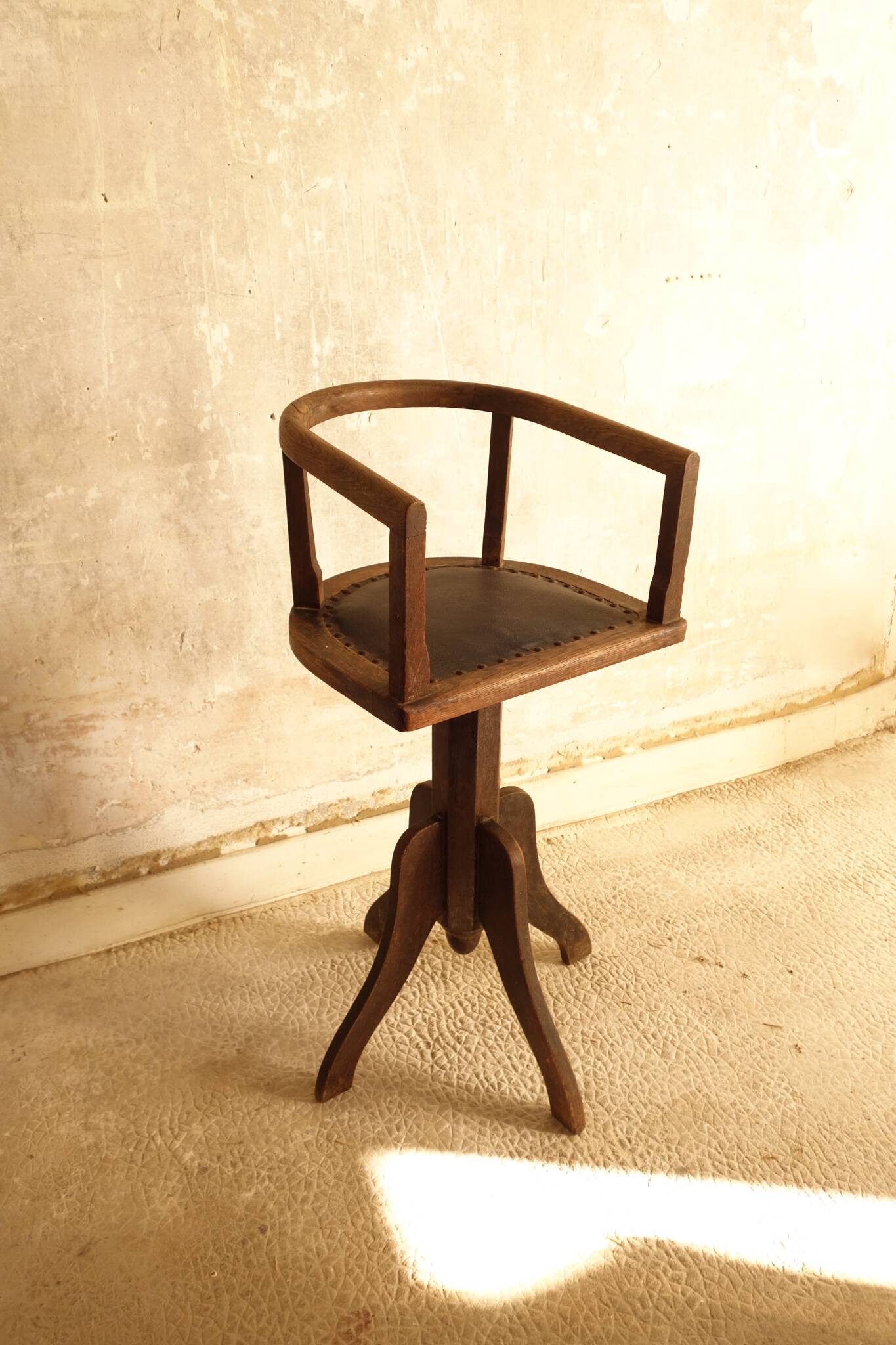 Antique wooden swivel chair