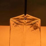 Minimalist glass table lamp from the 80s with a pleated shade.