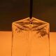 Minimalist glass table lamp from the 80s with a pleated shade.