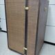 Wardrobe trunk on casters in mahogany and woven rattan.