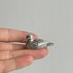 Set of 6 silver-plated metal ducks, name holders and knife rests.