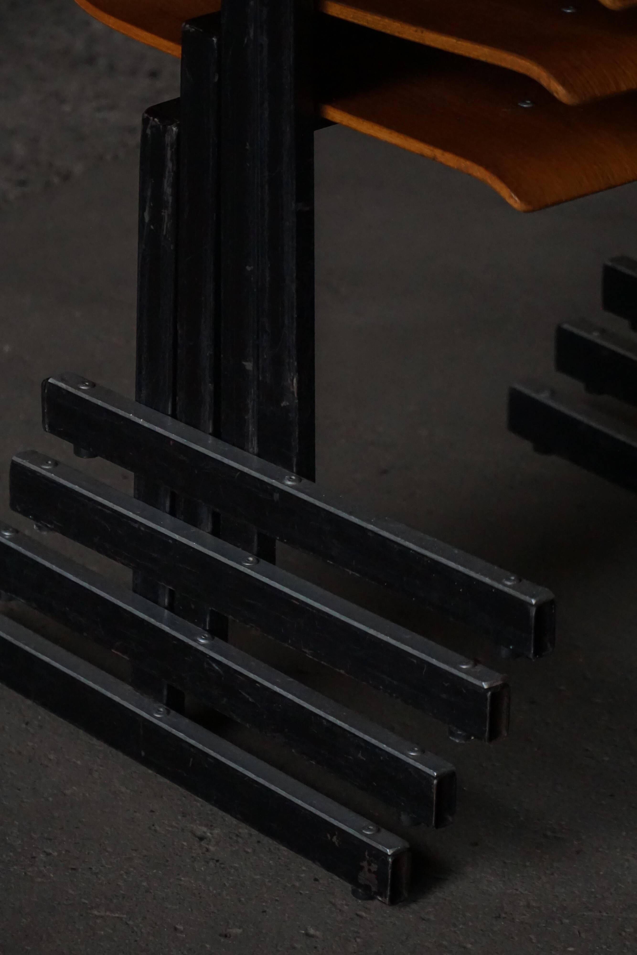 Set of 6 industrial stackable chairs by Niels Larsen, black metal and oak, 1960s.
