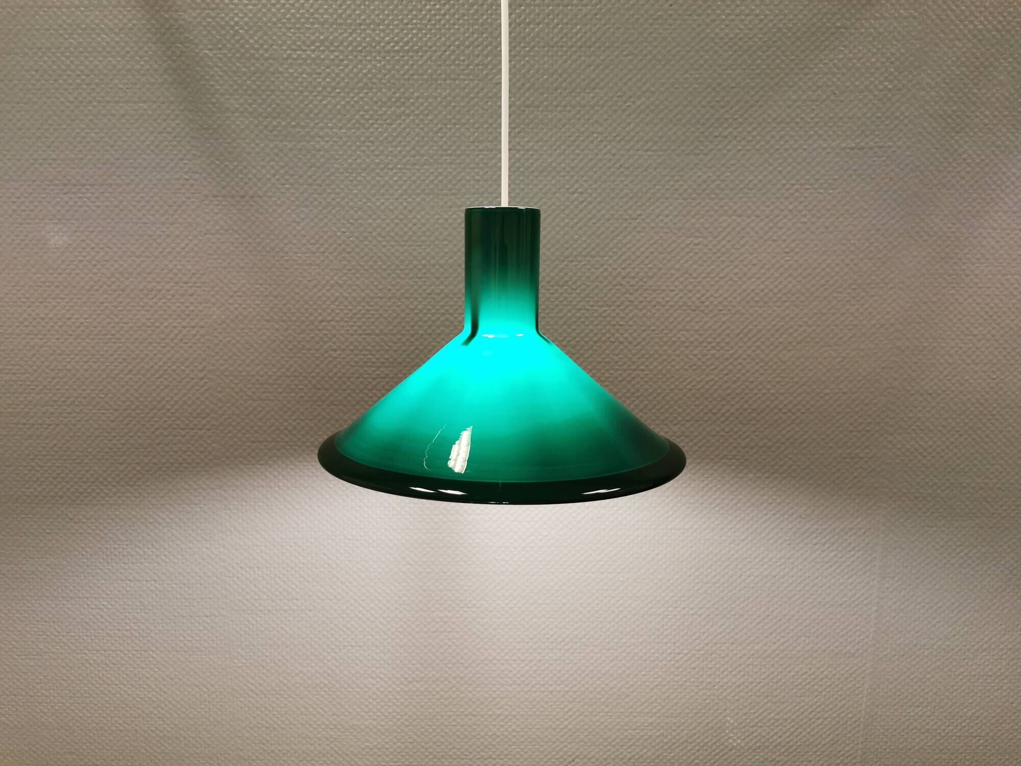 Green glass hanging lamp in double layer glass. Designed by Michael Bang for Holmegaard Denmark 1972