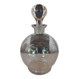 Round chiseled glass carafe