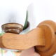 Duo of wooden appliques and tulip globe in scrambled glass, based on brass