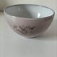 Glazed earthenware bowl, Millian pottery, France, stylised floral decoration.