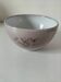 Glazed earthenware bowl, Millian pottery, France, stylised floral decoration.