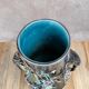 Antique vase in slipware with elephant and flower decoration.