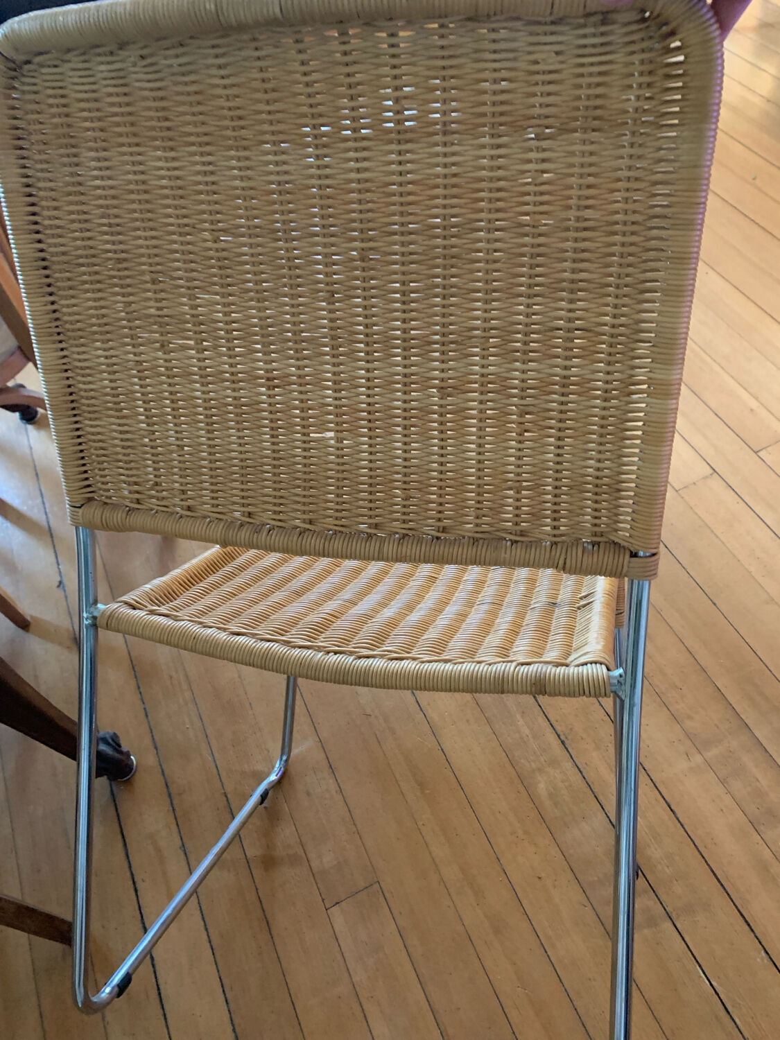 Vintage wicker and chrome chair from the 1970s.