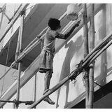 Young Indian perched on a scaffolding