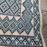 White and blue hand-woven rug in natural wool