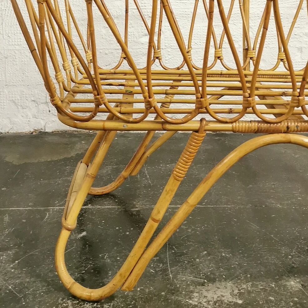 Baby cradle in vintage rattan