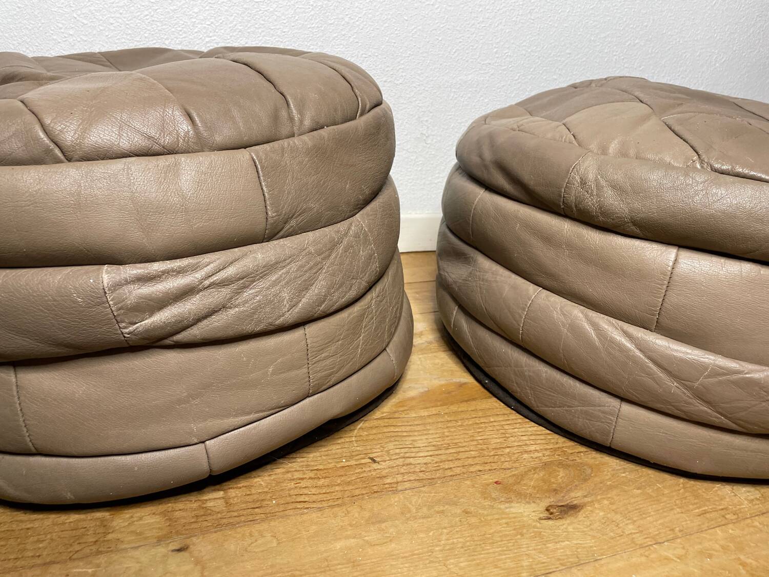 Pair of De Sède patchwork leather poufs