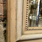 Miroir à fronton sculpté, stuc et bois peint de style Napoléon III - début