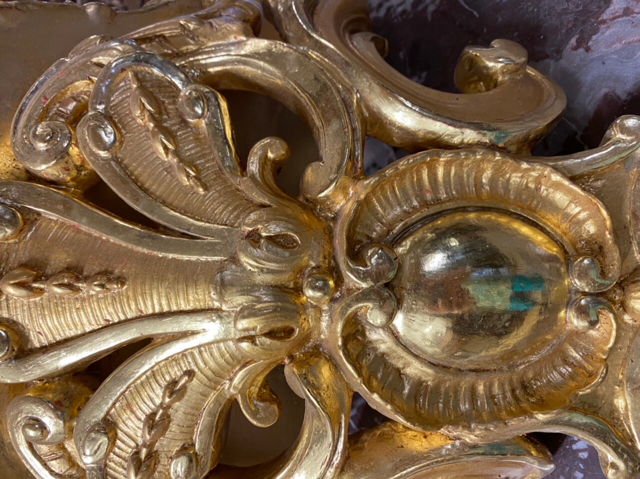 Golden wall applique with gold leaf
