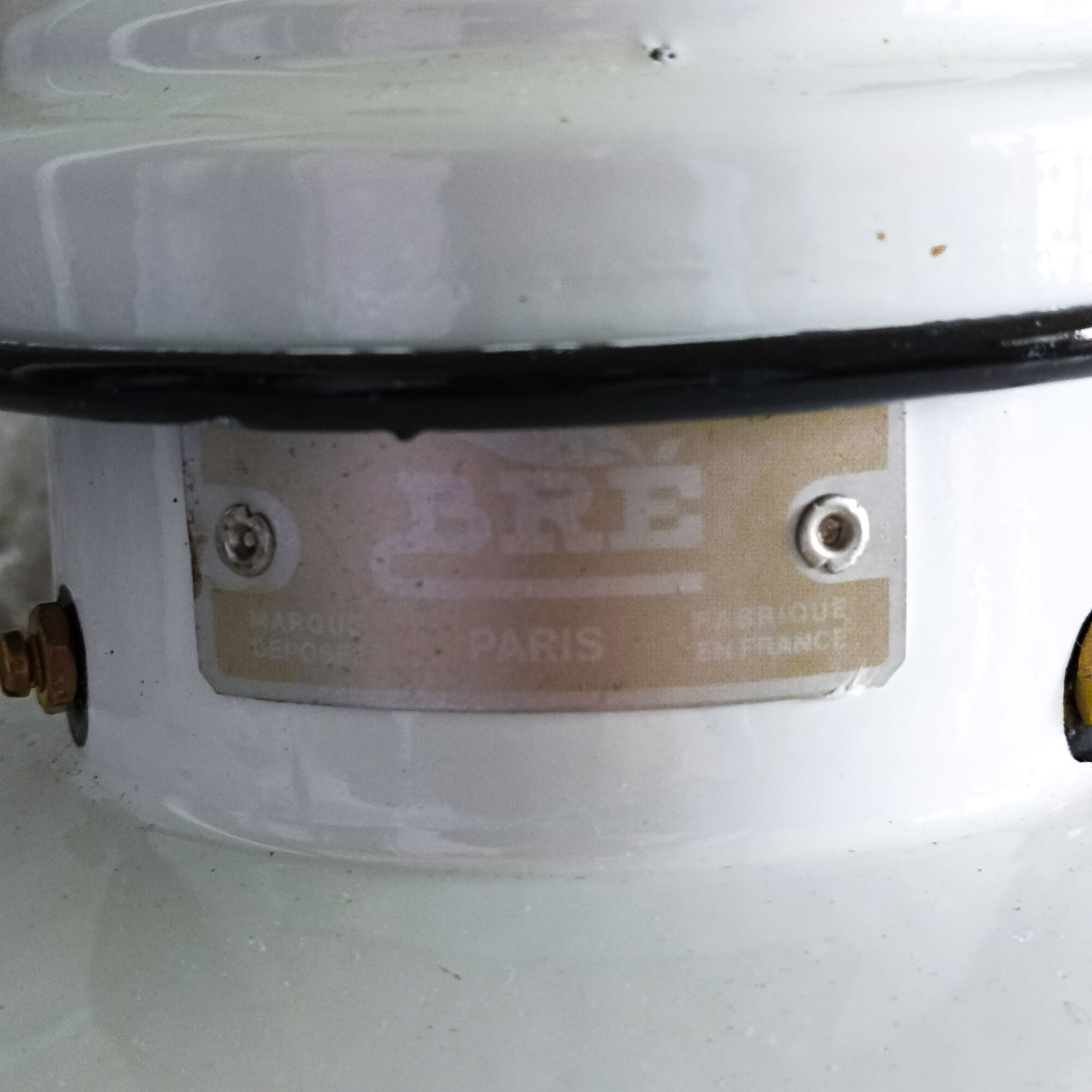 Old enamelled sheet metal suspension with glass cup