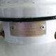 Old enamelled sheet metal suspension with glass cup
