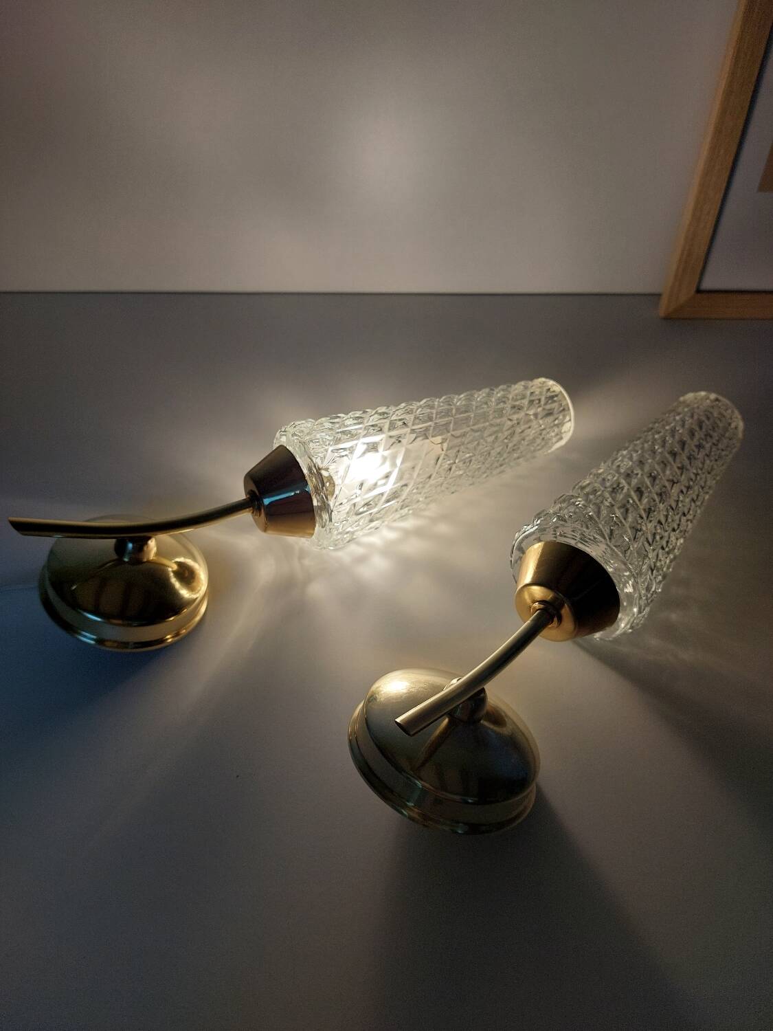 Pair of brass and glass wall lights
